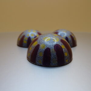 Color purple-Layer of Mascarpone,sweet caramel and  white chocolate ganache.(Dark Chocolate)